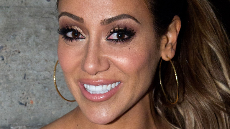 Melissa Gorga smiling from the side