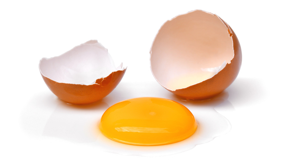 Cracked egg with brown shell