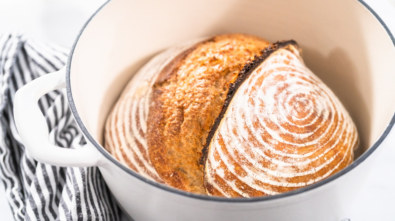 A sourdough boule in a Dutch oven