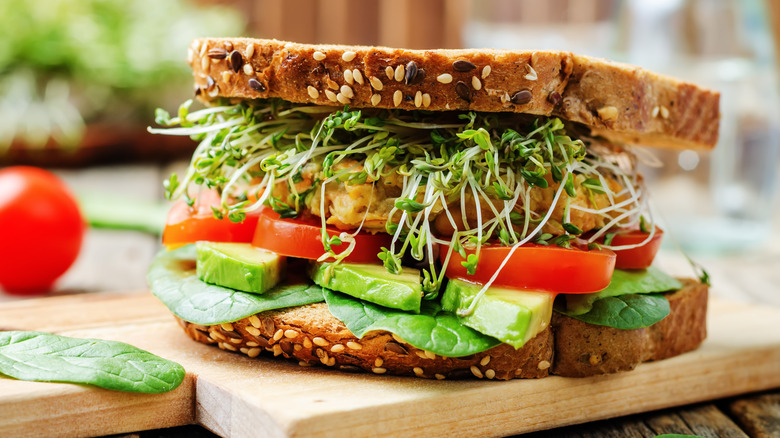 veggie sandwich on wooden board
