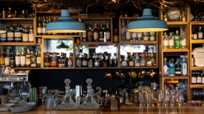 Bar with fully stocked shelves blurred in background