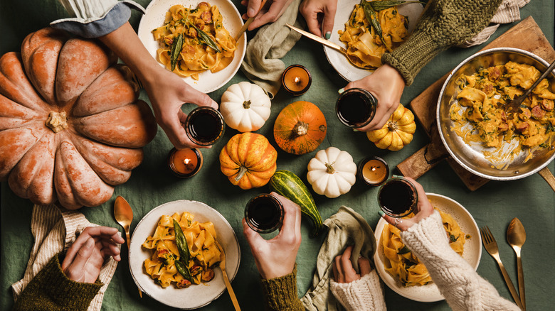 A table full of fall food and wine