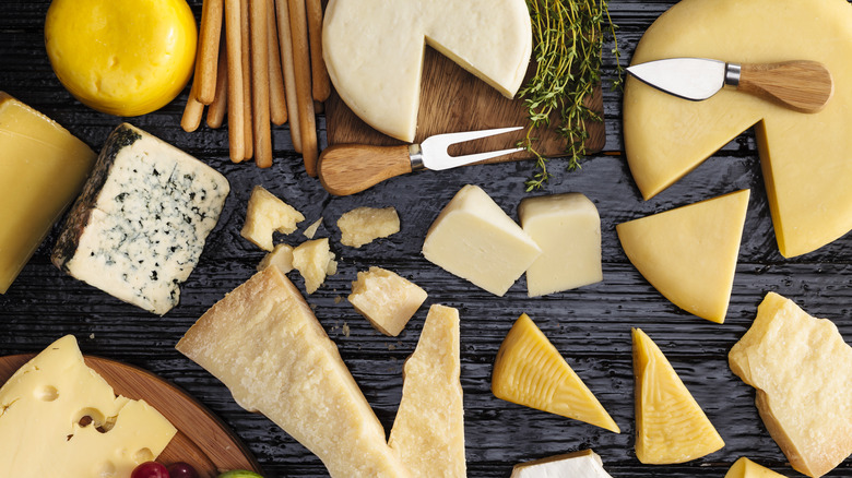 assorted cheeses on table