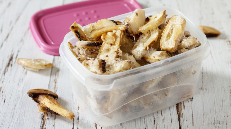 Packed mushrooms in air-tight pink container for storage