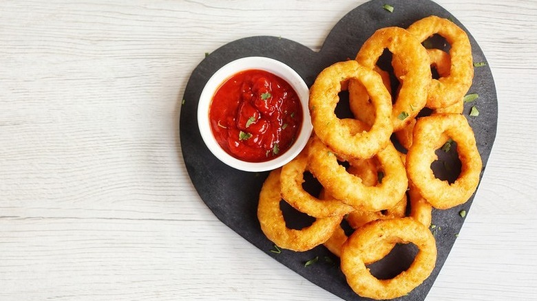 heart-shaped plate of onion rings