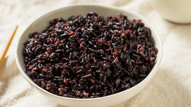 A bowl of cooked black rice