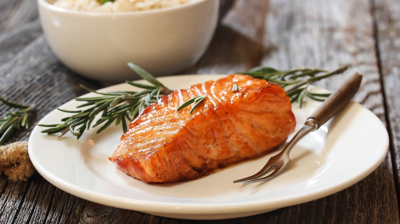 glazed salmon with rosemary garnish