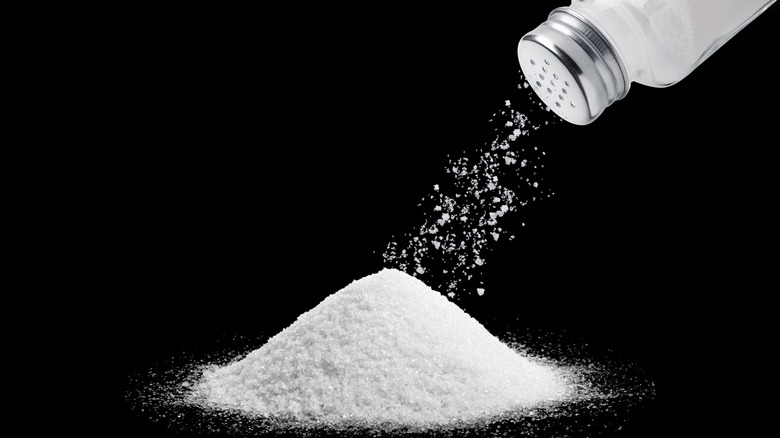 pile of salt with shaker