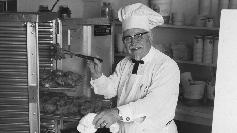 Colonel Sanders making fried chicken 
