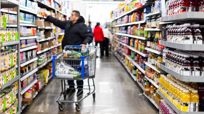 Customer with shopping cart in Walmart store