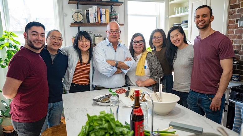 Andrew Zimmern with family around table