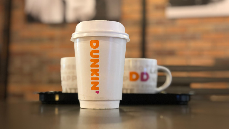 Dunkin' coffees on brown table