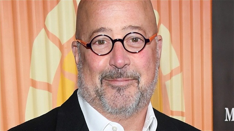 Andrew Zimmern wearing glasses