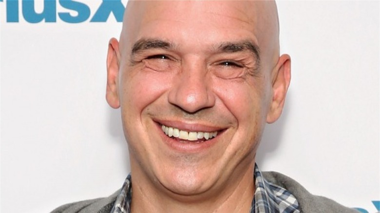 Michael Symon smiling on red carpet