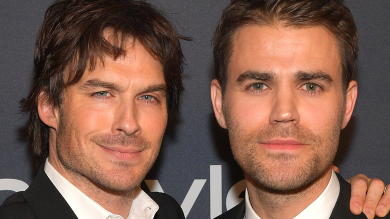 Ian Somerhalder and Paul Wesley posing at event