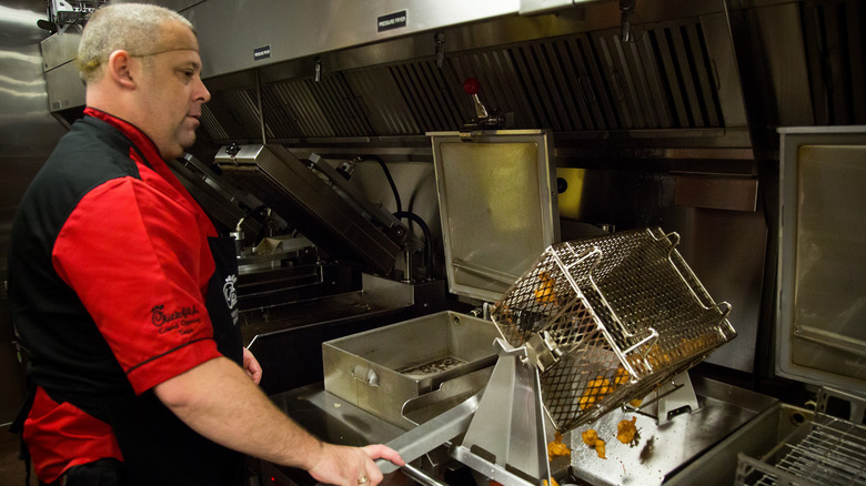 Chick-fil-a worker making nuggets