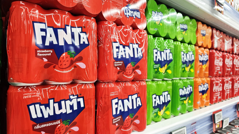 Cases of various flavors of Fanta on store shelf