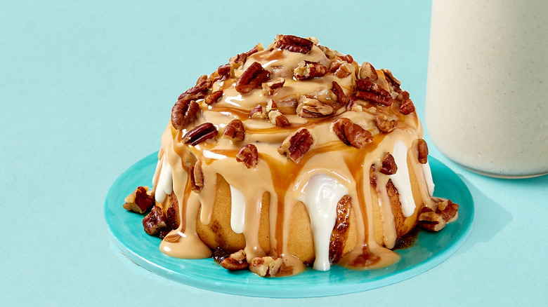 Cinnabon Caramel PecanBon next to cup