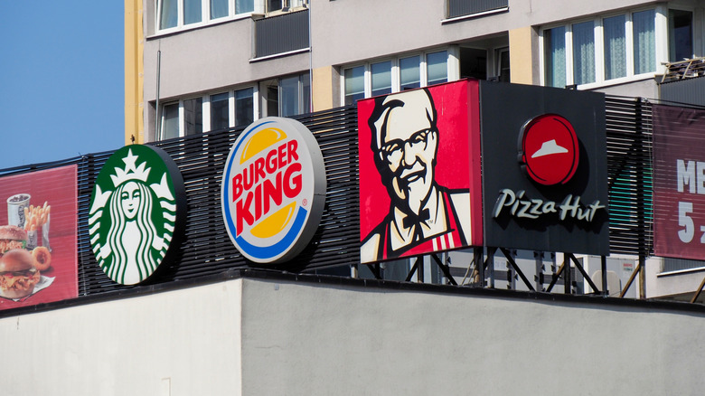 Row of fast food chain signs