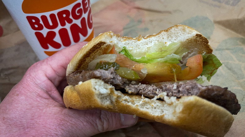 hand holding Burger King Whopper
