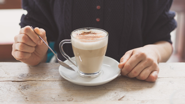 Person with a chai latte