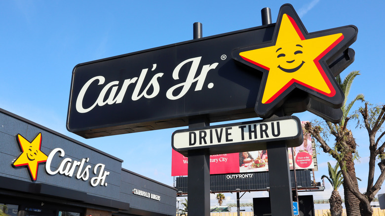 Carl's Jr. location, with its signs advertising the drive-thru and charbroiled burgers.