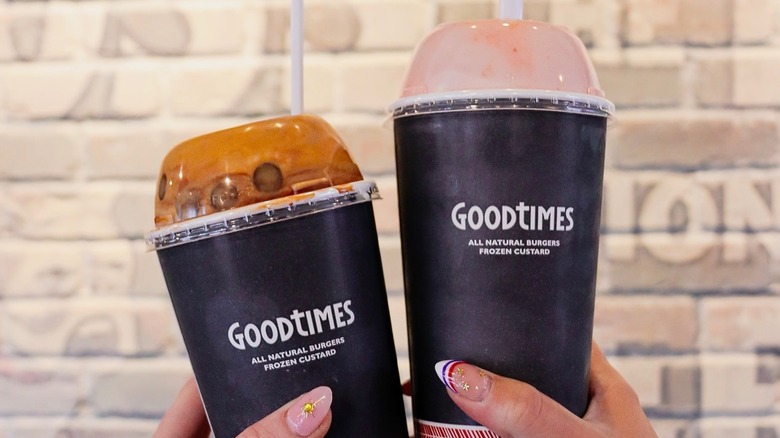 two Good Times milkshakes side by side in black to-go cups