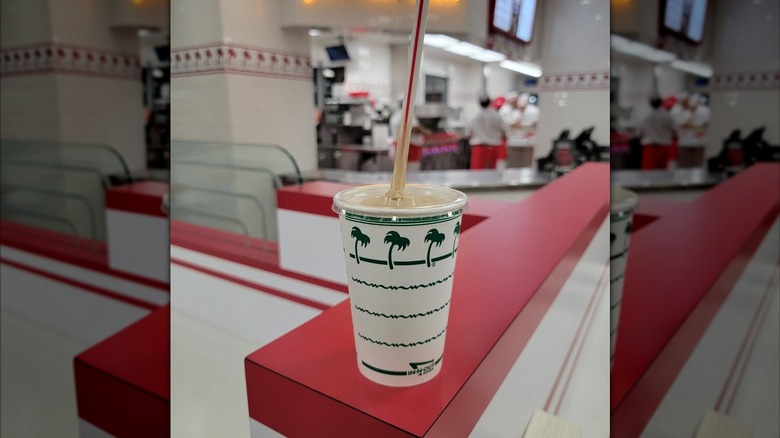 In-N-Out chocolate milkshake on a restaurant booth wall