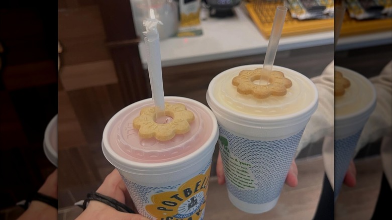 two people holding milkshakes from Potbelly