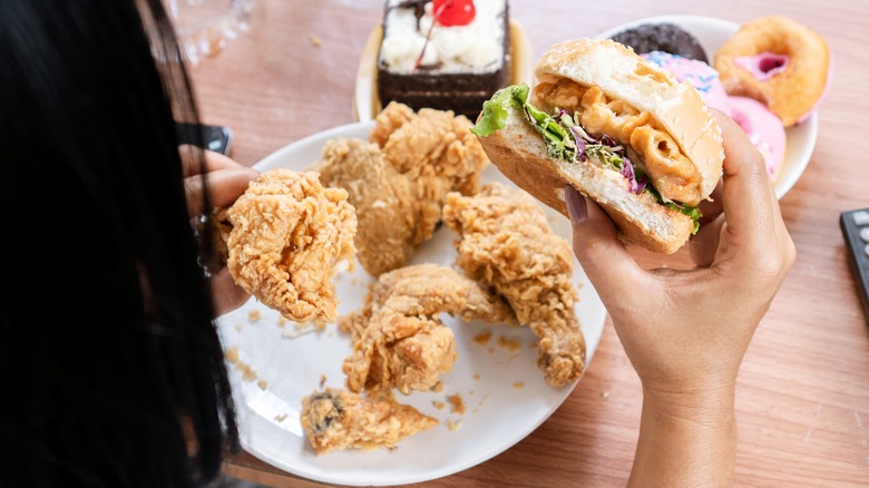 Woman eating fast food