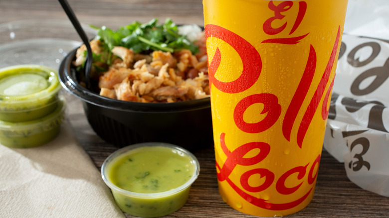 El Pollo Loco bowl with drink and green salsa