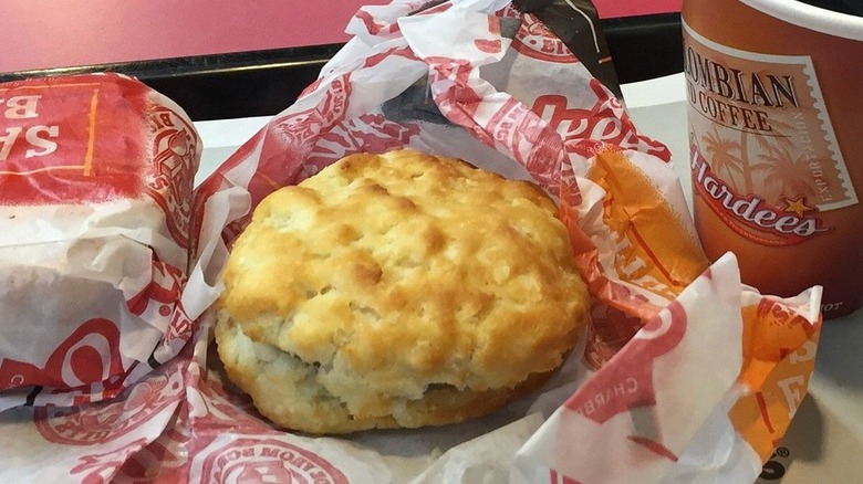 Hardee's Sausage and Egg Biscuit sandwich with a cup of coffee