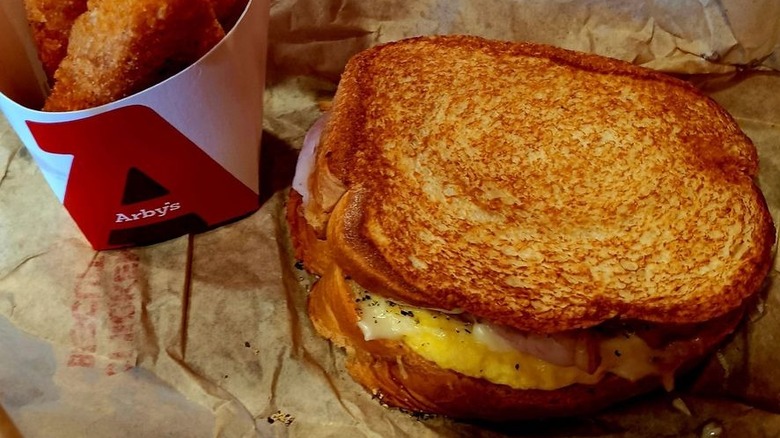 Close-up of Ham, Egg, and Cheese Sourdough sandwich from Arby's