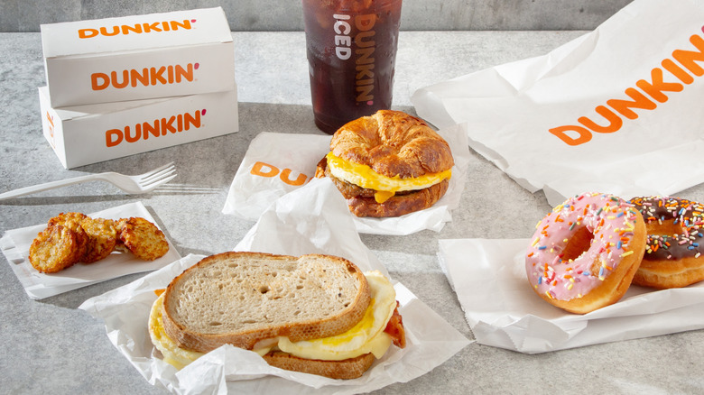 Dunkin' Donuts sourdough breakfast sandwich, croissant, donuts, and hashbrowns