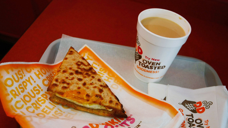Dunkin' Donuts breakfast sandwich with coffee