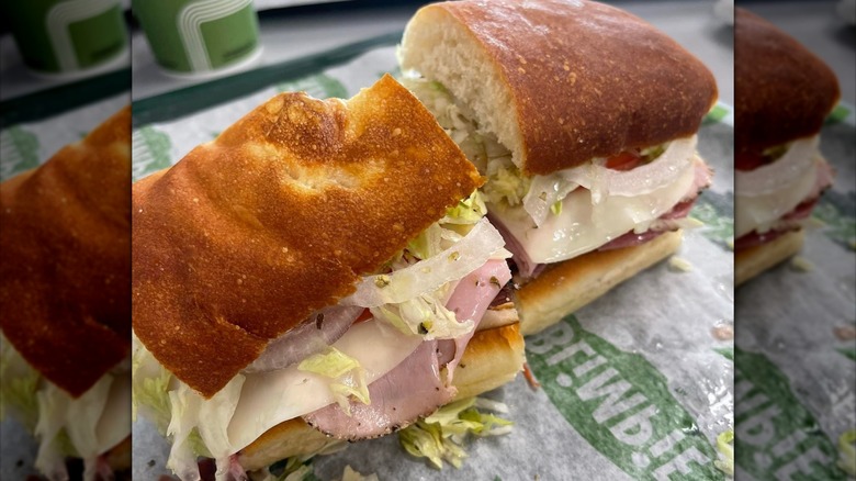 A Blimpie sandwich with meat, cheese, lettuce, and onions