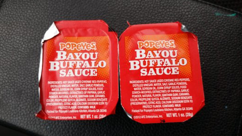 Popeye's sauces on black background