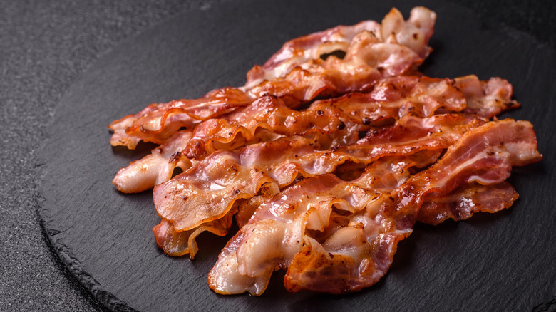 strips of cooked bacon on slate