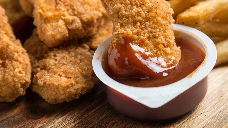 chicken nugget dipped in barbeque sauce