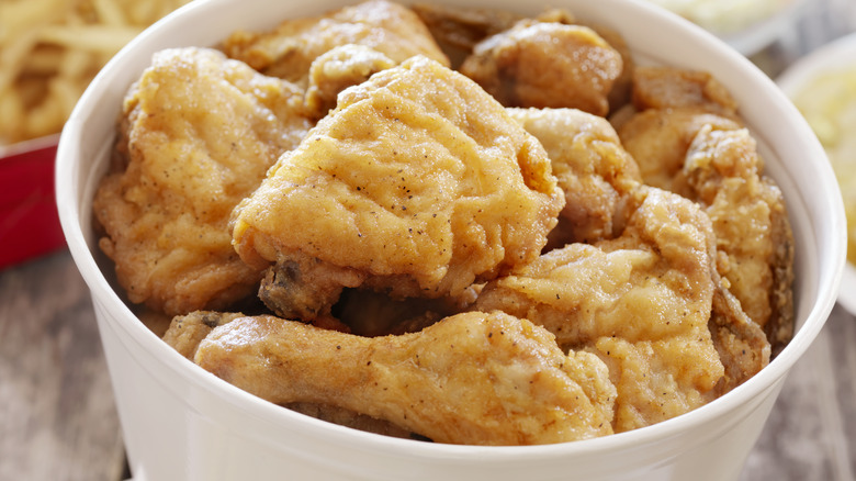 Bucket filled with fried chicken pieces