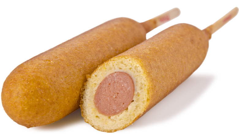 Pair of corn dogs on white