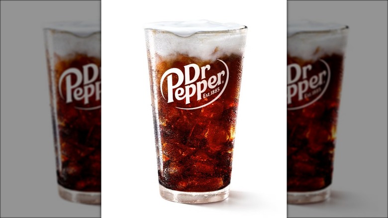 A Dirty Dr Pepper soda from McDonald's in a branded Dr Pepper glass.