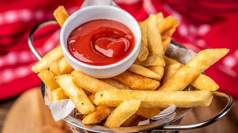 Tomato ketchup on a bowl of fries