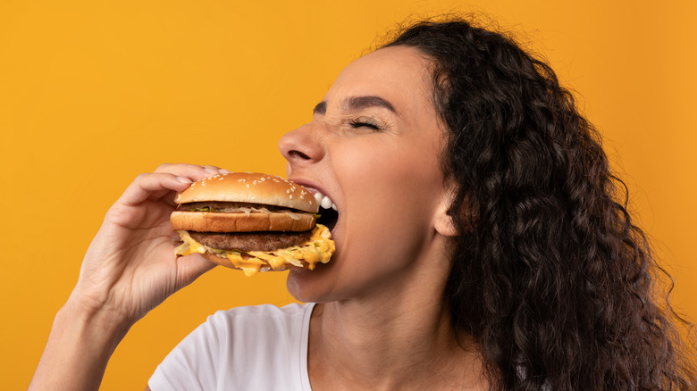 woman eating burger