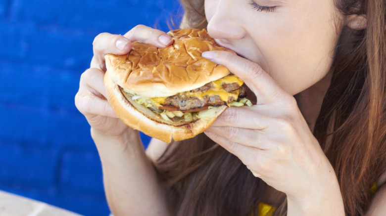 woman eating burger