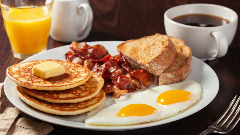 Plate of pancakes, eggs, and bacon