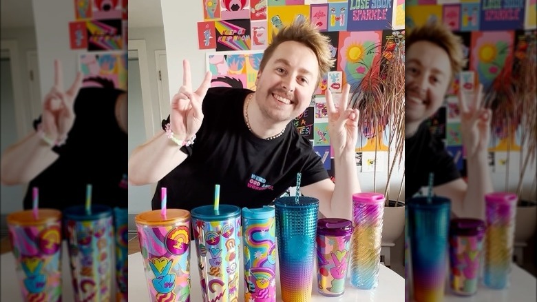 Artist Tim Singleton with Pride tumblers