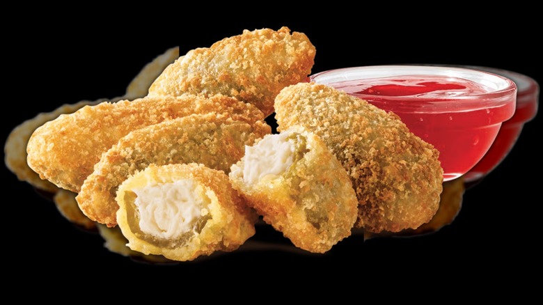 Arby's jalapeño bites on a black background
