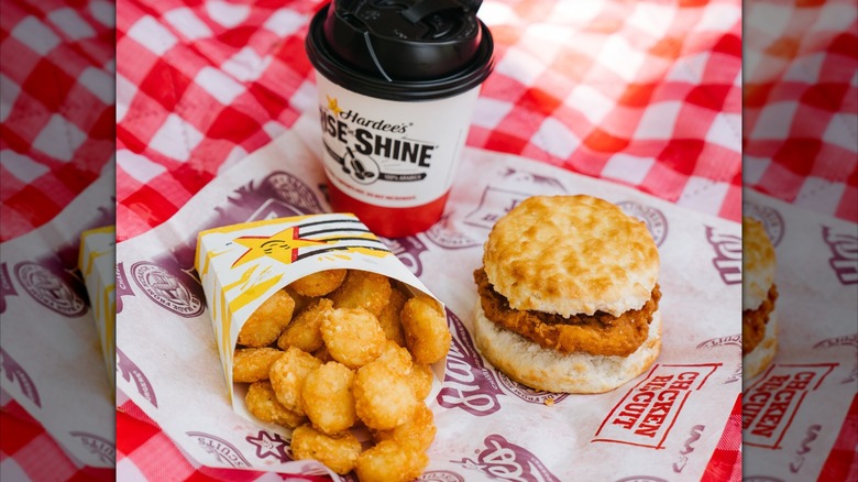 Hardee's breakfast meal with sandwich, coffee, and hash browns