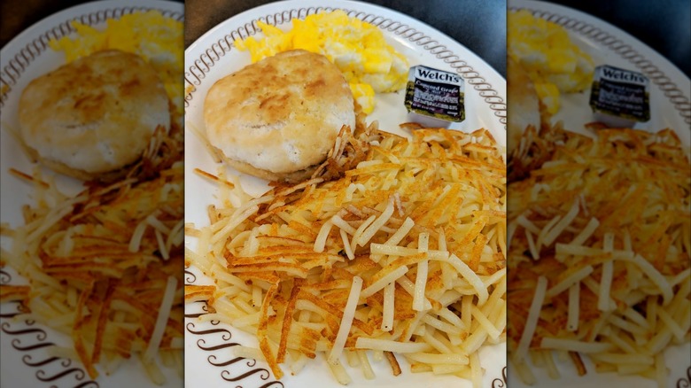 Plate of Waffle House hash browns, biscuit, eggs
